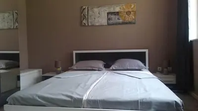 a bedroom with a large bed with two pillows at Snow Dreams 1 Grand Monastery in Pamporovo