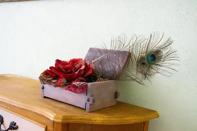 a box with flowers on top of a table at Infinity Boutique Apartments in Bansko