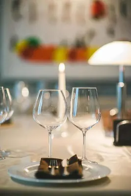 two wine glasses sitting on top of a table at Hotel Villa Ekaterina in Vakarel