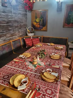 a long table with food on top of it at Boina House in Bansko