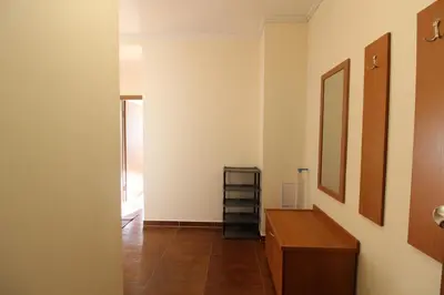 a hallway with a bathroom with a counter and a shelf at 2 bedroom apartment near Gondola in Bansko