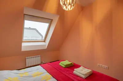 a bedroom with a bed and a window at Apartment City View 2 in Sofia