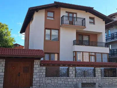 an image of a house with a garage at Guest House Ivan in Bansko