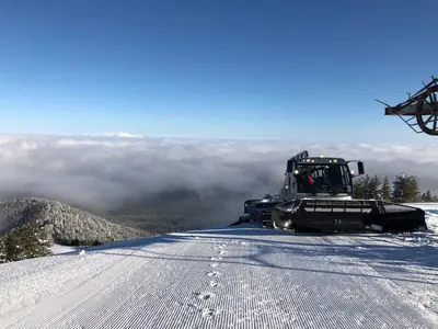 a bulldozer on top of a snow covered mountain at Hotel Malyovitsa in Govedartsi