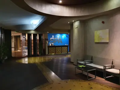 a lobby of a building with a sign on the wall at Pinewood ANG Apartment, Semiramida Borovets Hills in Borovets