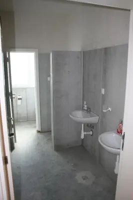a bathroom with two sinks and a window at Hostel Iliana Общежитие Илияна in Elin Pelin