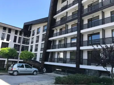 a car parked in front of a building at Aspen Valley in Razlog