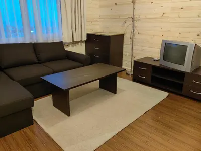 a living room with a couch and a tv at Bansko Royal Towers - Studio 945 in Bansko