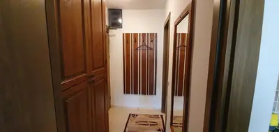 a room with a hallway with a mirror and a closet at Луксозно студио в Банско - малко кътче от рая. in Bansko