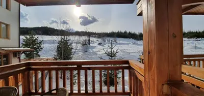 a view of a winter view from a cabin balcony at Луксозно студио в Банско - малко кътче от рая. in Bansko