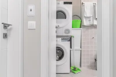 a laundry room with a washer and dryer at Stylish Residential Flat - with Parking & Balcony by Flat Mаnager in Sofia