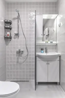 a white bathroom with a sink and a shower at Stylish Residential Flat - with Parking & Balcony by Flat Mаnager in Sofia