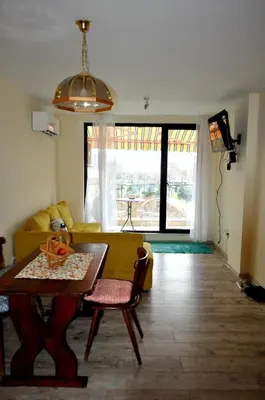 a living room with a couch and a table at New Apartment at a Great Location in Blagoevgrad
