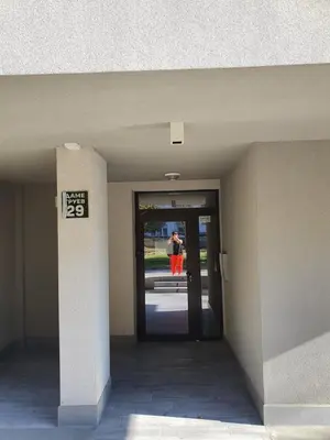 a person is standing outside of a building at New Apartment at a Great Location in Blagoevgrad
