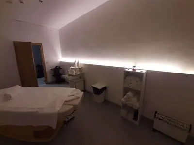 a small room with a bed and a bathroom at Flora Apartment 612A in Borovets