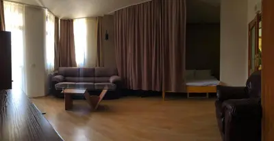 a living room with a couch and a chair at Flora Apartment 612A in Borovets