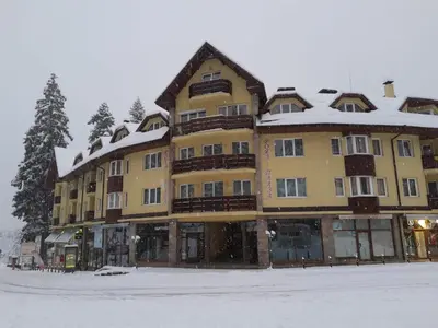 a large building with snow on top of it at BOROVETS Royal Plaza - A405 in Borovets