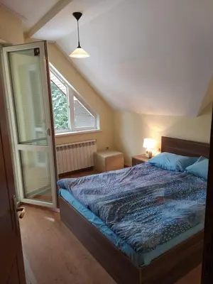 a bedroom with a large bed and a window at BOROVETS Royal Plaza - A405 in Borovets