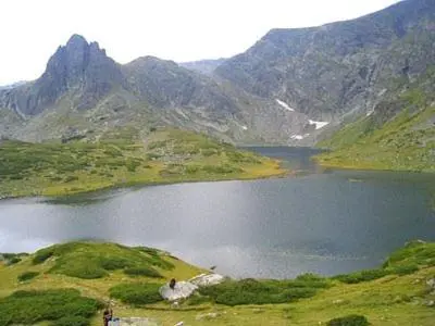 a lake in the middle of a mountain at BOROVETS Royal Plaza - A409 in Borovets