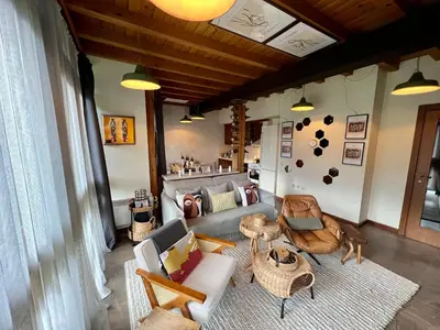 a living room with a couch and chairs and a table at Katarino Spa Chalet in Razlog