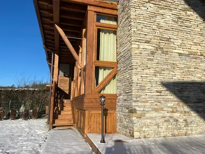 a wooden door on the side of a building at Katarino Spa Chalet in Razlog