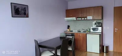 a small kitchen with a table and a microwave at Predela 1 - Studio 10 near Bansko Ski Lift in Bansko
