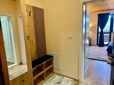 a room with a hallway with a door and a room with a door at Pamporovo Rhodopi Pearl Apartments - Private Apartments in Pamporovo