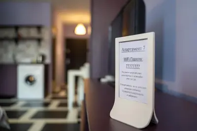 a white sign sitting on top of a table at Spacious apartment in the heart of Studentski grad in Sofia