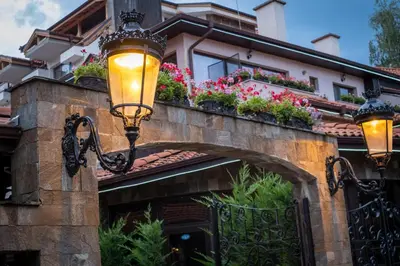 a house with flower boxes on a bridge at Хотел Том и Нези Класик in Velingrad
