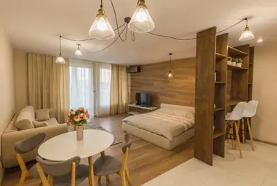a living room with a bed and a table at Studio Talisman III in Sofia