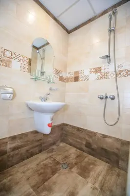 a bathroom with a sink and a shower at Guest House Amore in Sandanski