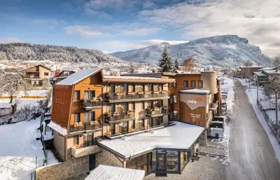 a hotel in a town in the snow at Hotel COTA1110 in Beli Iskar