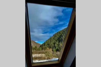 a window with a view of a mountain at Villa Aquila in Beli Iskar