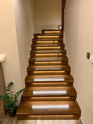 a stairway with wooden steps in a room at Къща за гости Амая - Сандански in Sandanski