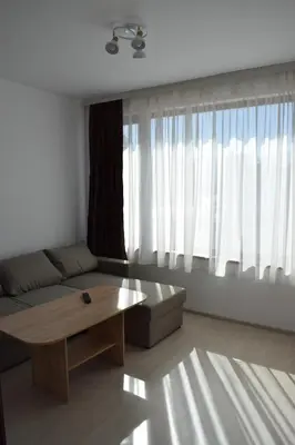 a living room with a couch and a coffee table at Къща за гости Шошови in Velingrad