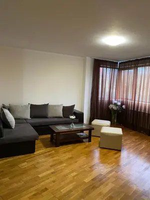 a living room with a couch and a coffee table at K's Place Apartment Pravets Golf Resort in Pravets