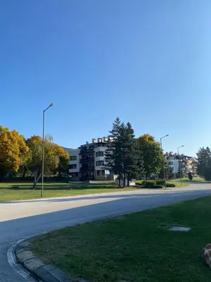 an empty street with a building in the background at K's Place Apartment Pravets Golf Resort in Pravets
