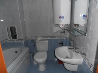 a bathroom with a toilet and a sink and a bath tub at Monastery 3 Apartments TMF in Pamporovo