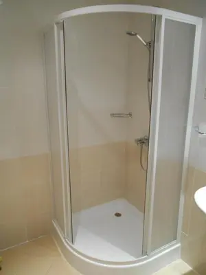 a shower with a glass door in a bathroom at Studio Villa Park 408 in Borovets