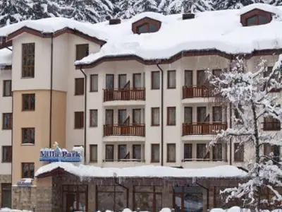 a large building with snow on top of it at Studio Villa Park 408 in Borovets