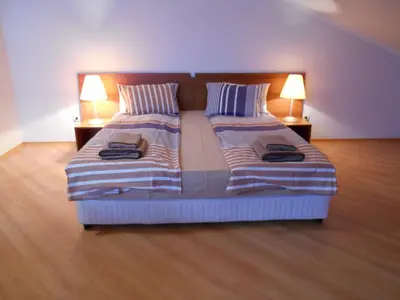 a bedroom with two beds with two lamps on them at Studio Villa Park 408 in Borovets