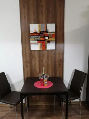 a black table with two wine glasses on it at Studio 1 Iceberg Borovets in Borovets