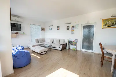 a living room with a couch and a table at AMAZING view, privacy and comfort - SPA Villa Krasi in Blagoevgrad