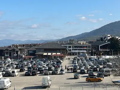 a parking lot filled with lots of parked cars at Ski Zone at Gondola, Warm and Cosy, WiFi, AC, Netflix, Perfect One Bedroom appartment, Beautiful View in Bansko