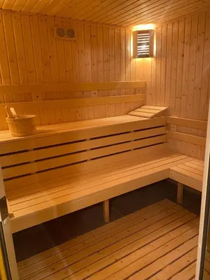 a wooden sauna with a bench in it at Kleptuzaparts in Velingrad
