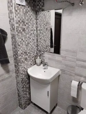 a bathroom with a sink and a mirror at Apartment Anelia 3 in Plovdiv