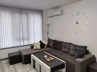 a living room with a couch and a table at Apartment Anelia 3 in Plovdiv