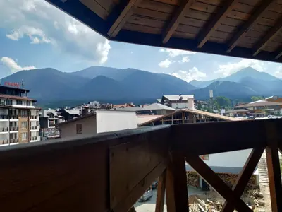 a view of a city from a balcony at Large Gondola Apartment - Center, Neon in Bansko