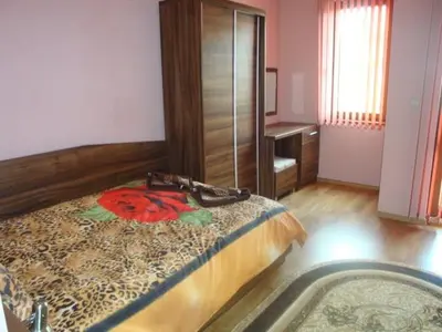 a bedroom with a bed and a bath tub at Tzvetelina Palace Hotel in Dolna Banya