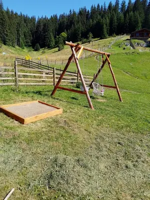a basketball hoop in a field with a net at къщи за гости Под звездите in Pamporovo
